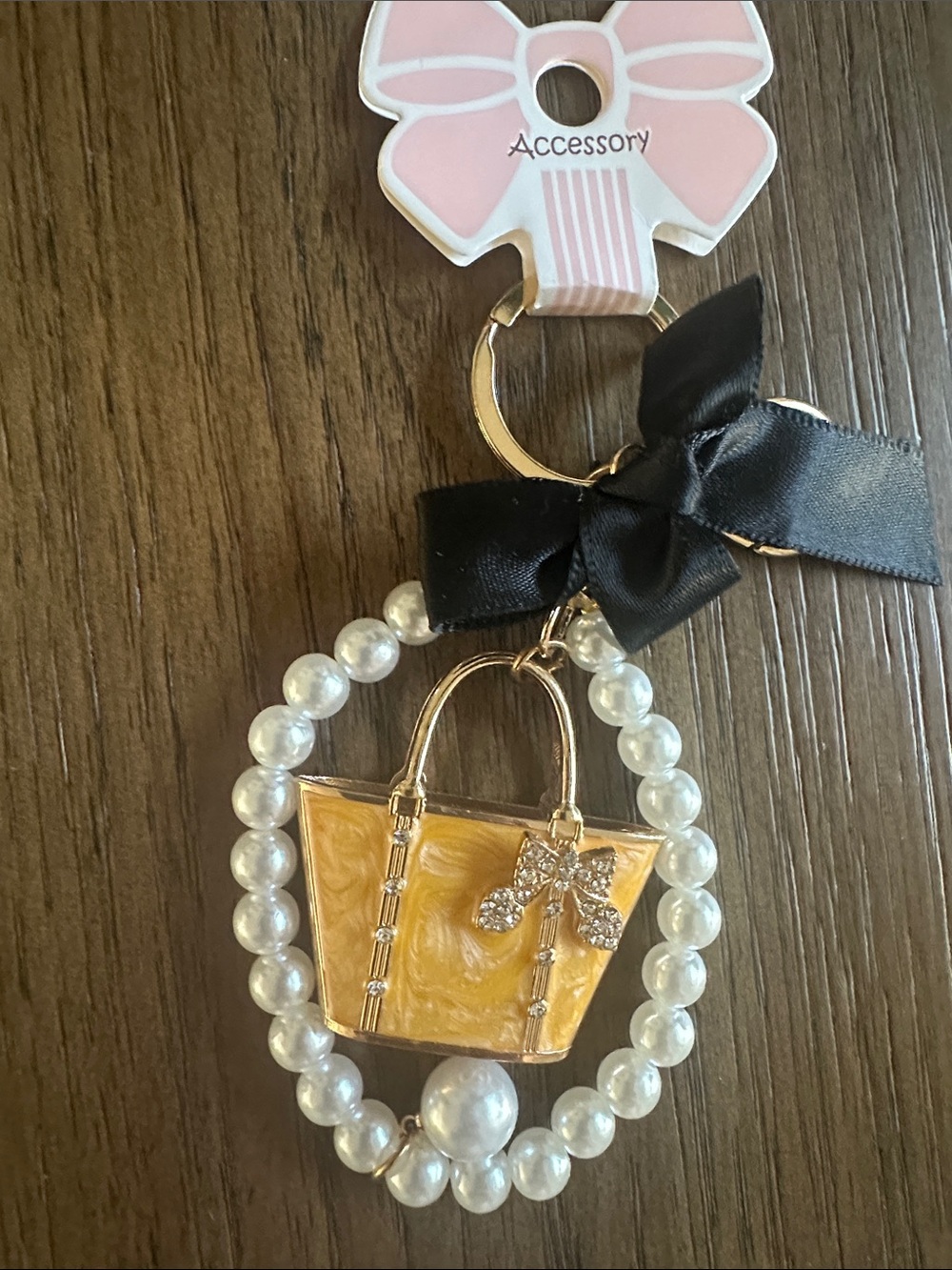Pearl-Accent Yellow Handbag Keychain with Black Bow